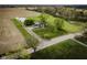 Expansive property featuring a well-maintained lawn, charming home, and agricultural land in a serene setting at 5707 S Burlington Dr, Muncie, IN 47302