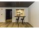 Stylish basement bar features a black countertop and shelving perfect for mixing drinks at 5707 S Burlington Dr, Muncie, IN 47302