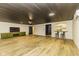 Expansive basement features a modern bar and stylish built-in cabinets at 5707 S Burlington Dr, Muncie, IN 47302