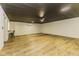 Open basement area perfect for entertaining, with a bar and laminate floors at 5707 S Burlington Dr, Muncie, IN 47302
