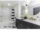 Bathroom with double vanity, white marble tile floor, tub and shower combo at 5707 S Burlington Dr, Muncie, IN 47302