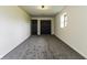 Bedroom featuring neutral colors, carpet, window, and double closets at 5707 S Burlington Dr, Muncie, IN 47302