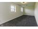 Empty bedroom showcasing neutral paint and plush gray carpeting at 5707 S Burlington Dr, Muncie, IN 47302