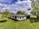Charming exterior of a single story home features a neatly manicured lawn, fresh landscaping, and inviting curb appeal at 5707 S Burlington Dr, Muncie, IN 47302