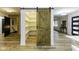 Spacious pantry with custom wood door and ample shelving for organized storage solutions at 5707 S Burlington Dr, Muncie, IN 47302