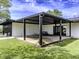 Outdoor patio area perfect for entertaining, featuring covered seating and a seamless transition to the indoors at 5707 S Burlington Dr, Muncie, IN 47302
