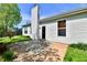 Backyard with brick patio, chimney, lush lawn, and a door, perfect for outdoor living at 5809 Scotland St, Indianapolis, IN 46234