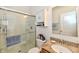 Updated bathroom features a glass-enclosed shower and stylish vanity at 5809 Scotland St, Indianapolis, IN 46234