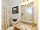 Bright bathroom featuring a shower/tub combo and granite countertops at 5809 Scotland St, Indianapolis, IN 46234
