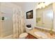 Bright bathroom featuring a shower/tub combo and granite countertops at 5809 Scotland St, Indianapolis, IN 46234