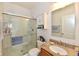 Modern bathroom featuring a glass-enclosed shower and granite vanity top at 5809 Scotland St, Indianapolis, IN 46234