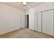 Empty bedroom with carpet, white trim, and closet at 5809 Scotland St, Indianapolis, IN 46234