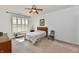 Brightly lit bedroom with carpet, ceiling fan, and lots of natural light at 5809 Scotland St, Indianapolis, IN 46234