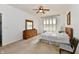 Bright bedroom with a window, dresser and serene ambiance at 5809 Scotland St, Indianapolis, IN 46234