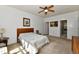 Cozy bedroom featuring a ceiling fan and a relaxing, carpeted atmosphere at 5809 Scotland St, Indianapolis, IN 46234