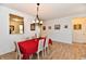 Dining room includes an open concept and hanging light fixture, illuminated by natural light at 5809 Scotland St, Indianapolis, IN 46234