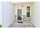 Covered front porch with a glass paneled front door and sidelight window, offering a warm welcome at 5809 Scotland St, Indianapolis, IN 46234