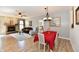 Inviting living room featuring a fireplace, ceiling fan, and an adjacent dining area at 5809 Scotland St, Indianapolis, IN 46234