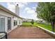 Wooden deck with integrated seating offering views of a well-maintained lawn and distant houses at 5864 Mustang Ter, Plainfield, IN 46168