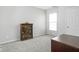 Neutral toned bedroom with a glass shelved bookcase, soft carpet, and plenty of natural light at 5864 Mustang Ter, Plainfield, IN 46168