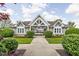 Charming clubhouse featuring a covered entryway, manicured landscaping, and a welcoming ambiance for residents at 5864 Mustang Ter, Plainfield, IN 46168