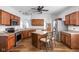 Spacious kitchen with wood cabinets, stainless steel appliances, a center island and hardwood floors at 5864 Mustang Ter, Plainfield, IN 46168