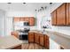 Well-lit kitchen featuring wood cabinets, stainless steel appliances, and modern fixtures at 5864 Mustang Ter, Plainfield, IN 46168