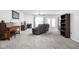 Spacious living room with plush carpet, a fireplace, and comfortable seating, perfect for relaxation at 5864 Mustang Ter, Plainfield, IN 46168