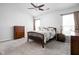 Spacious main bedroom featuring a ceiling fan, two windows, carpet, and ample closet space at 5864 Mustang Ter, Plainfield, IN 46168