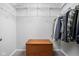 Organized walk-in closet featuring adjustable shelving and a storage chest at 5864 Mustang Ter, Plainfield, IN 46168