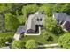 Beautiful home showcasing roof, landscaping, and long driveway in a mature neighborhood at 5925 Silas Moffitt Way, Carmel, IN 46033