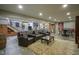 Open-concept basement rec room with pool table, wet bar, and lounge area at 5925 Silas Moffitt Way, Carmel, IN 46033