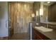 Bathroom with tiled shower, wood vanity and brown countertop at 5925 Silas Moffitt Way, Carmel, IN 46033