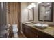 Bathroom with double sinks, wood accents, wood vanity and tiled floors at 5925 Silas Moffitt Way, Carmel, IN 46033
