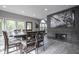 Elegant dining area adjacent to a fireplace, offering a comfortable and inviting space at 5925 Silas Moffitt Way, Carmel, IN 46033