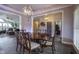 Dining room with wood table, ornate chairs, and gray walls at 5925 Silas Moffitt Way, Carmel, IN 46033