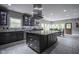 Modern kitchen featuring a large island, stainless steel appliances, and stylish cabinetry at 5925 Silas Moffitt Way, Carmel, IN 46033