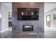 Cozy living room featuring a modern fireplace and stylish tiled flooring at 5925 Silas Moffitt Way, Carmel, IN 46033