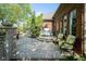 Outdoor kitchen and patio featuring a built-in grill, stone accents, and comfortable seating for entertaining at 5925 Silas Moffitt Way, Carmel, IN 46033