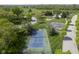Aerial view of neighborhood tennis court, playground and basketball court with green space at 5925 Silas Moffitt Way, Carmel, IN 46033