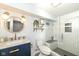 Updated bathroom featuring a large walk-in shower, modern vanity and fixtures at 6167 Ralston Ave, Indianapolis, IN 46220