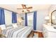 Bedroom with wooden floors, ceiling fan, and lots of natural light at 6167 Ralston Ave, Indianapolis, IN 46220