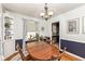 Dining room with wood table, four chairs and classic chandelier at 6167 Ralston Ave, Indianapolis, IN 46220