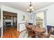 Dining room, showcasing a wood table, stylish light fixture, and easy access to the living room at 6167 Ralston Ave, Indianapolis, IN 46220