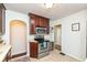 Kitchen features stainless steel appliances and dark wood cabinets at 6167 Ralston Ave, Indianapolis, IN 46220