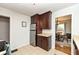 Kitchen view with stainless steel refrigerator and view into dining room at 6167 Ralston Ave, Indianapolis, IN 46220