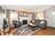 Inviting living room features a decorative fireplace, comfortable seating, and hardwood floors at 6167 Ralston Ave, Indianapolis, IN 46220