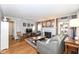 Spacious living room features a decorative fireplace, comfortable seating, and hardwood floors at 6167 Ralston Ave, Indianapolis, IN 46220