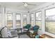 Bright sunroom with lots of windows, neutral furniture, and ceiling fan at 6167 Ralston Ave, Indianapolis, IN 46220