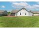 Spacious backyard featuring a wooden deck, lush lawn, and a shed, perfect for outdoor activities at 623 White Ash Trl, Mooresville, IN 46158